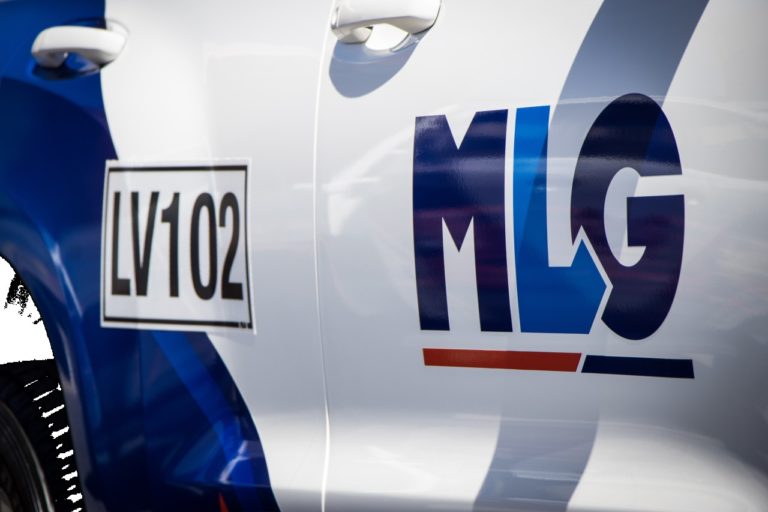 MLG Logo branded on the door of a vehicle
